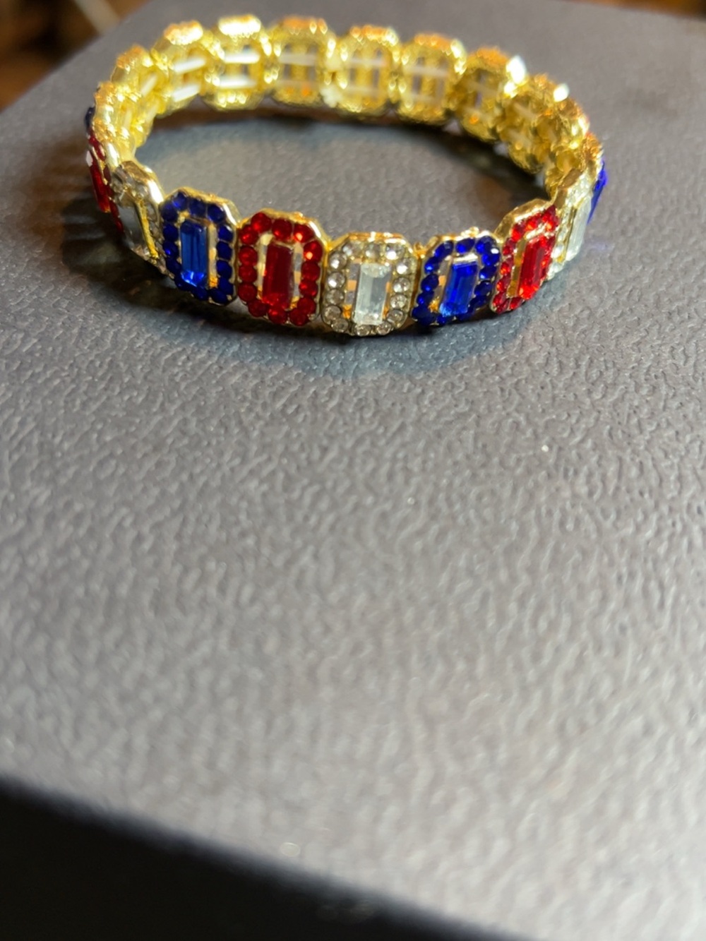 Gold Stretch Bracelet with Red, Blue and Clear Stones